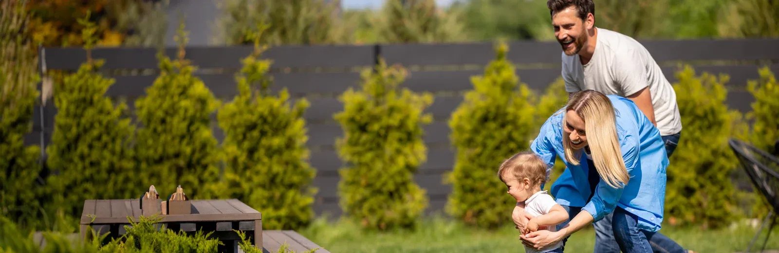 family playing and running in backyard