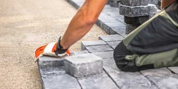 laying pavers of a walkway